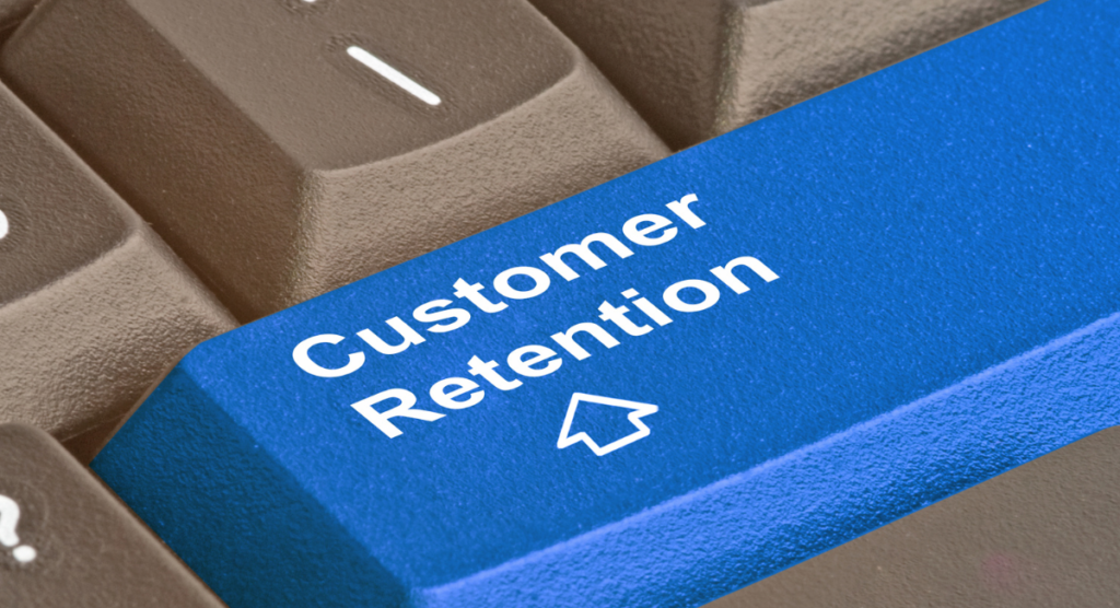 Close-up of a blue keyboard key labeled “Customer Retention,” highlighting how early user wins drive long-term product adoption.