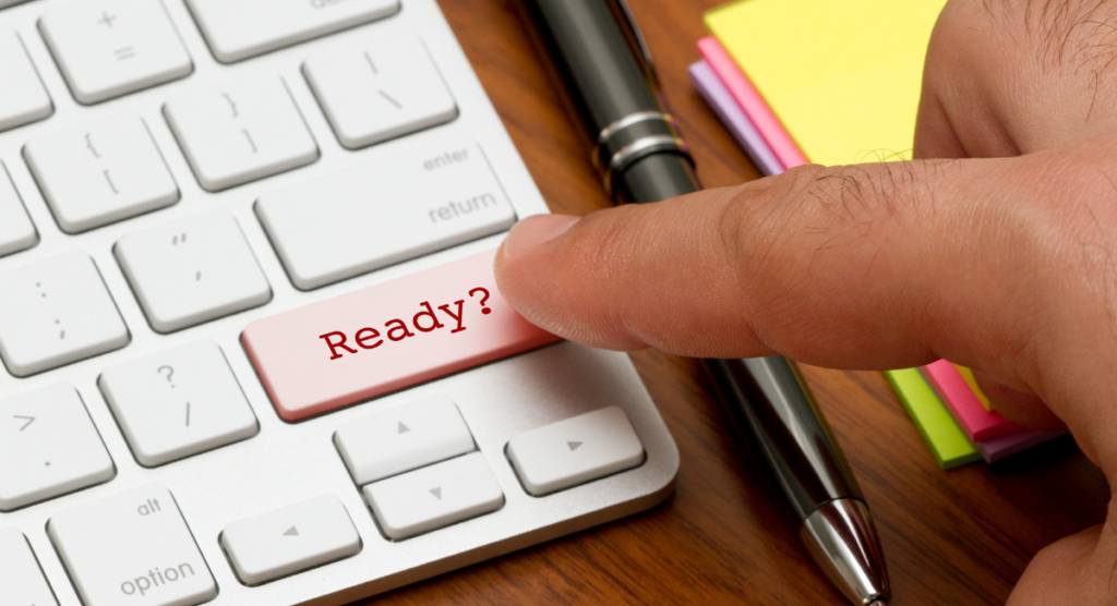 Finger pressing a keyboard key labeled “Ready?” symbolizing the gap between product complexity and a new user's readiness to engage.