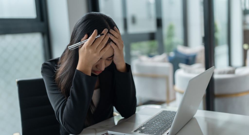 Frustrated professional at laptop, illustrating how users misidentify the real problem and keep fixing the wrong thing.