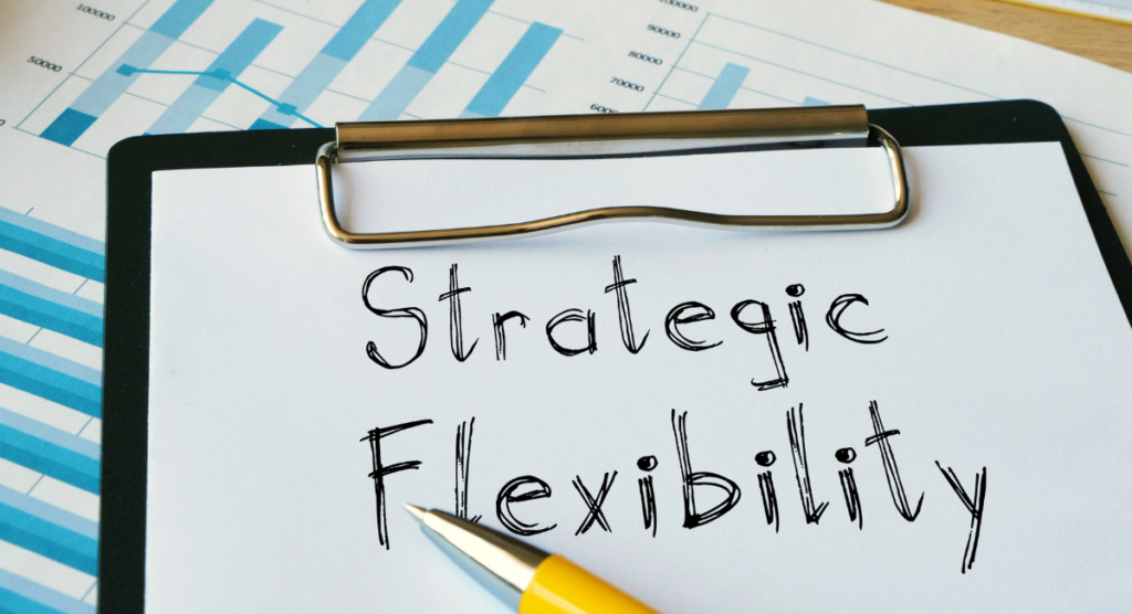 A clipboard showing the phrase Strategic Flexibility, highlighting the shift founders must make to communicate product value clearly.