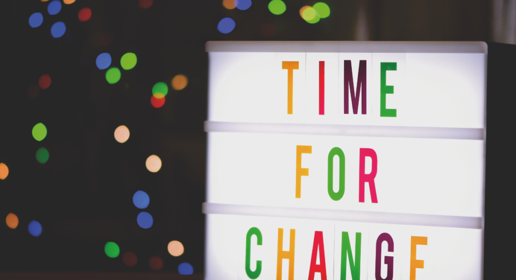 A lightbox sign reading “Time for Change,” symbolizing the need for SaaS companies to shift from hidden value to clear product storytelling.