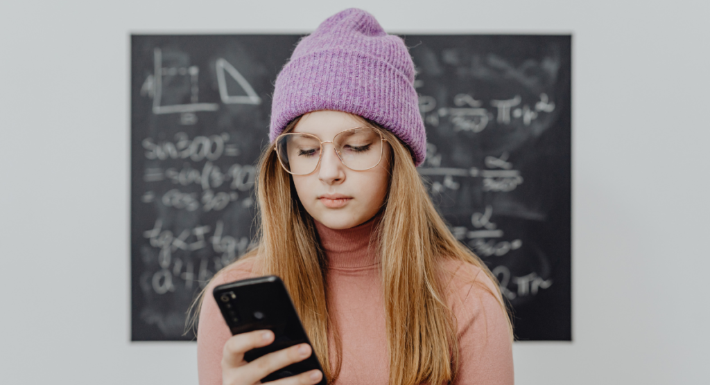 User scanning her phone, looking for a clear reason to care, mirroring how audiences judge ads in seconds.